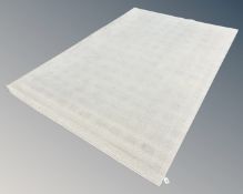 A contemporary cream wool carpet, 202cm by 298cm.