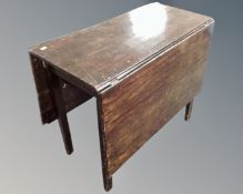 A 19th century drop leaf table.