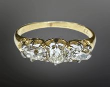 An 18ct gold three stone old-cut diamond ring, the total diamond weight estimated at 0.