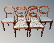 A set of six Victorian mahogany balloon back dining chairs.