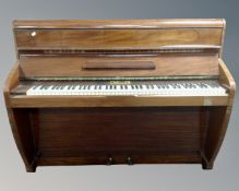 A Challen upright overstrung piano.