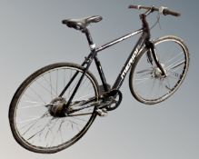 A gent's Merida Speeder hybrid bike.