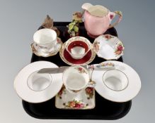 A tray containing two country artist bird ornaments on wooden stands together with assorted