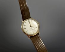 A gent's gold Omega manual wind wristwatch, silvered dial with subsidiary seconds, Omega crown,