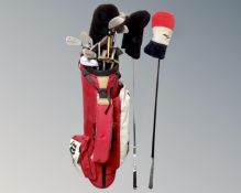 A Wilson golf bag containing assorted irons, drivers and putters.