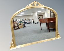 A Victorian style gilt dome topped overmantel mirror.