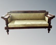 A 19th century mahogany Biedermeier scroll arm hall settee.