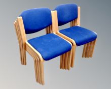 Eight stackable office chairs.