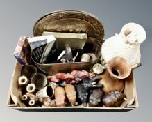 A box of carved wooden elephant figures, brass ware including candle sticks, table lamp,