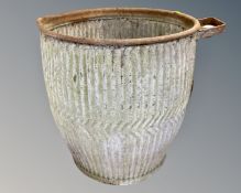 A large galvanized container.