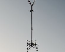 A contemporary metal hat and coat stand