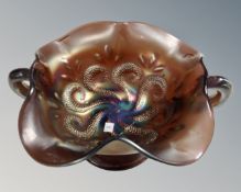 An antique Dugan 'Question Marks' carnival glass amethyst footed bon bon dish,