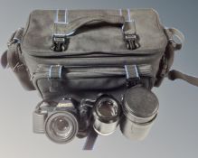 A Canon T50 camera with Canon FD 50mm lens and a Mamiya/Sekor 135mm lens in Chinon camera bag.