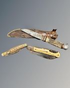 Two vintage folding knives and a further knife in sheath