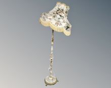 An onyx and gilt brass standard lamp together with a similar coffee table.