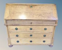 A nineteenth century Continental oak fall fronted writing bureau,