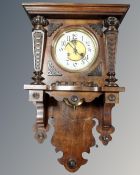 A Continental eight day wall clock with enamelled dial