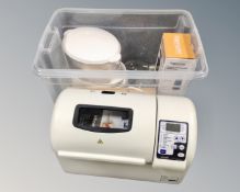 A group of kitchen wares, breadmaker, egg master, film dispenser, carving set, steamer,