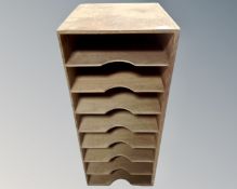 A 20th century plywood chest fitted with eight compartments,