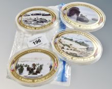 Four large oval commemorative issue tokens of World War II.