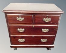 A 19th century stained pine four drawer chest.