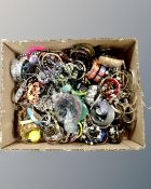 A box of assorted costume jewellery, bangles, necklaces etc.