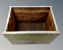 Two galvanized water containers.