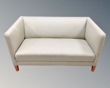 A Scandinavian two seater hall settee in green fabric,