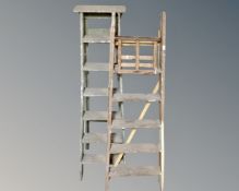 Two wooden step ladders