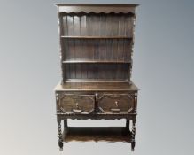 An Edwardian stained oak welsh dresser.