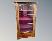 A continental glazed walnut bookcase.