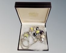 A silver charm necklace and similar bracelet, each stamped 925.