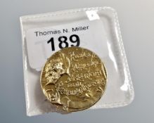 An antique commemorative Spanish coin converted to a brooch dated 1896.