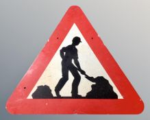 An enamelled metal roadworks sign.