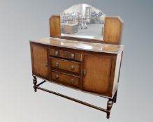 A 1930's carved oak mirror back sideboard (width 138cm)