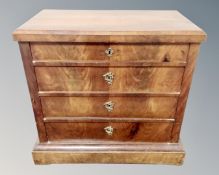 A 19th century continental mahogany chest of four drawers.