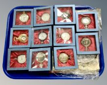 A tray of eleven assorted collector's pocket watches with associated magazines.