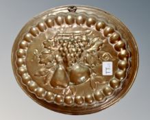 An antique copper jelly mould,