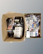 Two boxes of assorted cables and chargers, iPod cases,