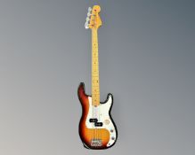 An electric bass guitar.