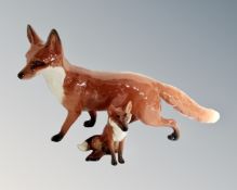 A Beswick fox, length 24cm, together with a seated Beswick fox.