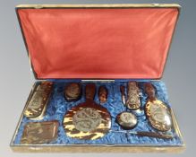 An Oriental faux tortoiseshell dressing table set together with a Japanese lacquered four fold