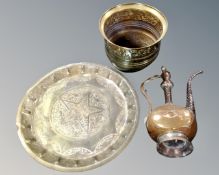 A brass charger together with planter and Eastern copper kettle