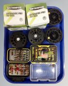 A tray containing two Ron Thompson Dynadisc Pro fly reels with spools together with two cases
