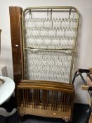 A pair of 20th century beech rail bed frames with spring bases.