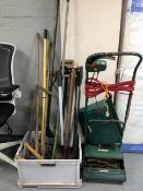 A Qualcast electric lawn mower with grass box together with a plastic tub containing a good