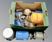 A box of camping gas stoves and lights