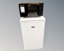 A Zanussi underbench freezer together with Russell Hobbs microwave