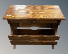 A heavy oak magazine table fitted a drawer