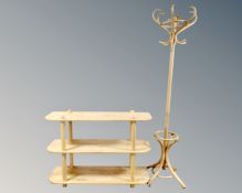 A pine three tier shelving unit together with bentwood hat and coat stand